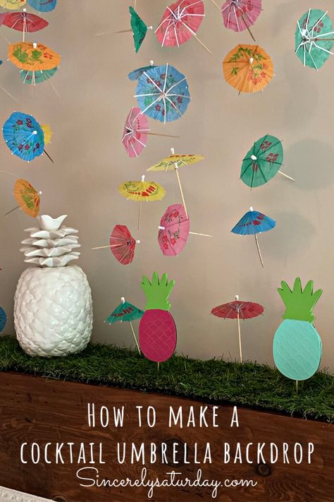 How to make a cocktail umbrella backdrop/decor. Learn how to make a cheap and easy summer backdrop for all your parties. All you need is a few simple items. #cocktail #diy #craft #cheap #easycraft #backdrop #desserttable #mantel #tropical #tropicalparty #poolparty #graduationparty #luau #hawaiianparty #funparty #sincerelysaturdayblog Diy Luau Party Decorations Dollar Stores, How To Make A Cocktail Umbrella, Cheap Summer Birthday Party Supplies, Cocktail Umbrella Craft, Umbrella Backdrop, Umbrella Drinks Tropical, Backyard Kids Party, Summer Backdrop, Cocktail Umbrella