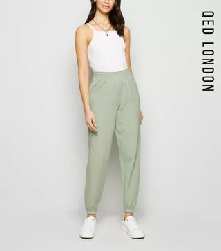 light green cuffed joggers - comes in other colours Light Green Joggers Outfit, Light Green Trousers Outfit Women, Light Green Pants Outfit Women, Light Green Sweatpants Outfit, Light Green Trousers Outfit, Light Green Pants Outfit, Tapered Pants Outfit, Green Joggers Outfit, Green Trousers Outfit