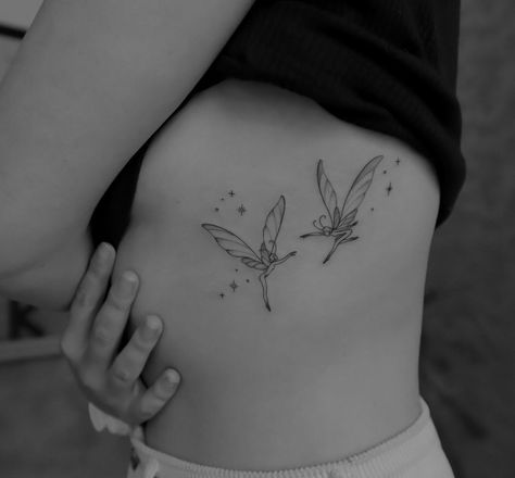 Line Art Fairy Tattoo, Many Tattoos On Arm, Fairy Floral Tattoo, Fairy Rib Tattoo, Barcelona Flower Tattoo, Dainty Fairy Tattoo, Ribcage Tattoos For Women, Fairies Tattoo, Pixie Tattoo