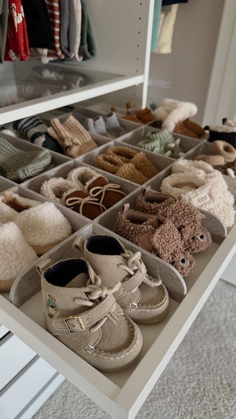 A nursery closet organized with a built-in wardrobe featuring pull-out drawers with shoe organization as well as space for hanging clothes Nursery Closet System, Nursery Shoe Storage, Organization Ideas For The Home Clothes, Organizing A Nursery, Baby Boy Closet Ideas, Newborn Room Organization, Nursery Organization Tips, Baby Sock Organization, Baby Room Closet Organization