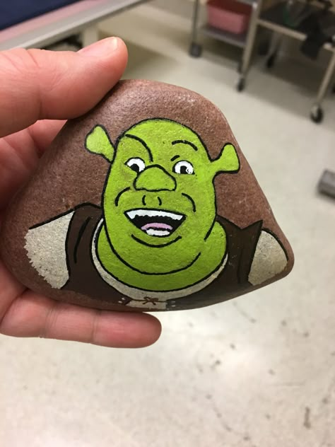 Shrek painted rock Shrek Rock Painting, Rock Painting Characters Easy, Hulk Rock Painting, Shrek Painting, Shrek Pumpkin, Rock Painting Ideas Characters, Character Rock Painting, Rock Painting Sponge Bob, Shrek Drawing