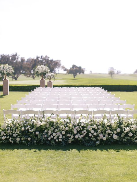 White Chairs Wedding, Wedding Ceremony Chairs, Vow Exchange, White Wedding Ceremony, Inside Weddings, Ceremony Chairs, White Chairs, Aisle Flowers, Golf Course Wedding