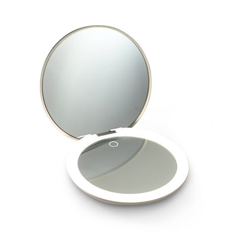 A perfect travel mirror featuring a 1x and 10x magnification. The slim and sleek design is ideal for placing in your pocket, handbag, or purse. Unlike most small magnifying mirrors, the 5-inch size is large enough to see your full face. The simple and intuitive design allows the light to be dimmed seamlessly. The rechargeable battery lasts up to 30 days, so leave it in your bag for daily touch-ups on the go. Cordless Lighting, Compact Makeup, Lighted Mirror, Travel Mirror, Magnifying Mirror, Light Works, Makeup Mirrors, Small Mirrors, Pocket Mirror