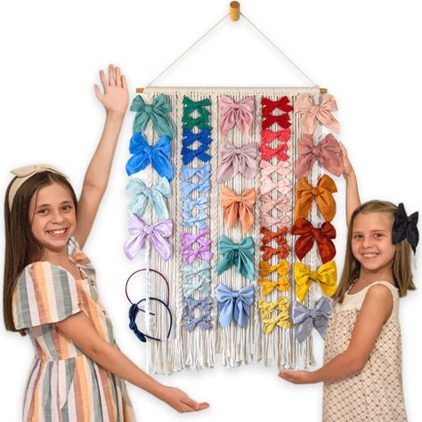 PRICES MAY VARY. 🎀 She's Beautiful and Smart! -- Organize hair bows, headbands and hair clips in boho style with this large capacity bow organizer by Laurel Reign. Hold ALL bow sizes with this beauty! It holds small, medium and large bows as shown in pictures. The lovely handwoven macrame design adds style to your room and the braids align hair bows and accessories so they stay organized. Kiss your clutter goodbye! 🎀 She Gets the Job Done! -- Laurel Reign hair bow organizer holds 90 bows of va Hair Clips Organizer, Reign Hair, Baby Headband Holders, Fun Bows, Christmas Bazaar Ideas, Headband Storage, Hair Clip Organizer, Hair Bow Organizer