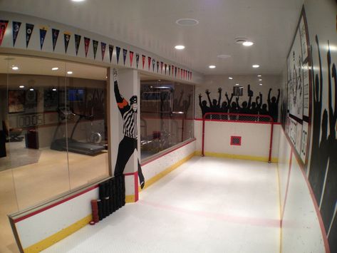 Sports Hangout Room, Basement Hockey Rink Ideas, Hockey Boards Wall, Basement Hockey Room, Synthetic Ice Rink Basement, Hockey Basement Ideas, Basement Hockey Rink, Basement Hockey, Hockey Basement