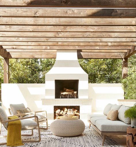 Outdoor fireplace and sitting area Outdoor Styling, Casa Exterior, Lulu And Georgia, Outdoor Living Room, Modern Patio, French Country Cottage, Outdoor Chair, Living Room Shop, Indoor Outdoor Rug