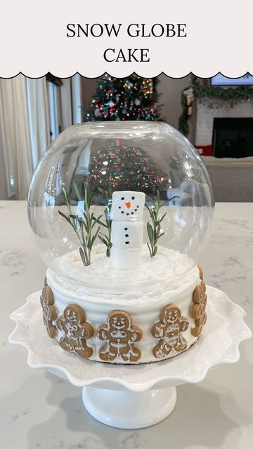 Kelsi || Content Creator on Instagram: "❄️ Snow Globe Cake ❄️⁣ ⁣ Here’s a fun way to turn a regular store bought cake into a magical Christmas cake! I added rosemary sprigs for the Christmas trees and turned these marshmallows into a snowman! Then I put a bowl over the top of the cake making it look like a snow globe! This was so easy and I love how it turned out!⁣ .⁣ .⁣ .⁣ .⁣ #christmas #christmasinspo #christmasideas #christmascake #christmastreat #christmastreats #snowglobe #snowglobes #christmasmagic" Snowglobe Cake, Snow Globe Cake, Snow Globe Cupcakes, Globe Cake, Christmas Tree Cupcakes, Christmas Food Treats, Snowman Cake, Diy Snow Globe, Store Bought Cake