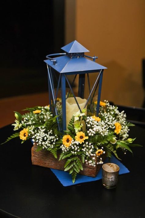 Navy Lantern(Pier 1), Barnwood boxes made by the brides father, blue paper mats for added color. Golden Votives. Navy Blue And Yellow Wedding Decorations, Navy Blue And Sunflower Wedding Theme, Navy Blue And Sunflower Wedding Ideas, Light Grey Groomsmen Suits, Light Grey Groomsmen, Sunflower Wedding Colors, Navy Blue Wedding Table, Navy Wedding Centerpieces, Paper Lantern Centerpieces