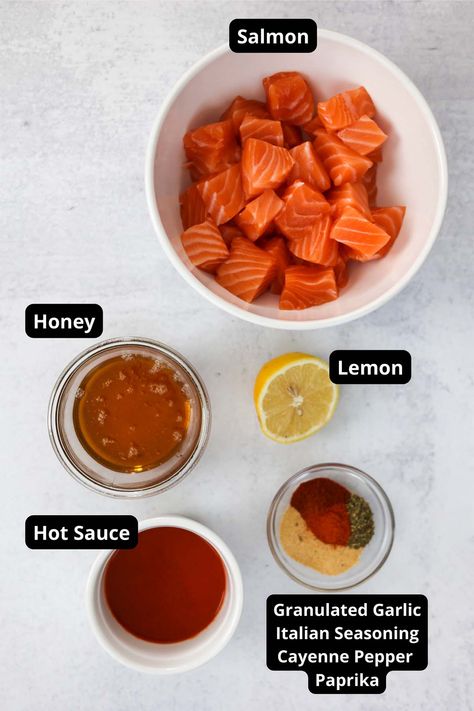 Hot Honey Salmon Bites (Air Fried) - Cooked by Julie Salmon Bites Bowl Airfryer, Air Fryer Salmon Bites Honey, Salmon Bites Air Fryer Recipes Healthy, Buffalo Salmon Bites, Air Fryer Hot Honey Salmon Bites, Crispy Hot Honey Salmon Bites, Honey Garlic Salmon Bites Air Fryer, Oven Baked Salmon Bites, Salmon Cubes Air Fryer