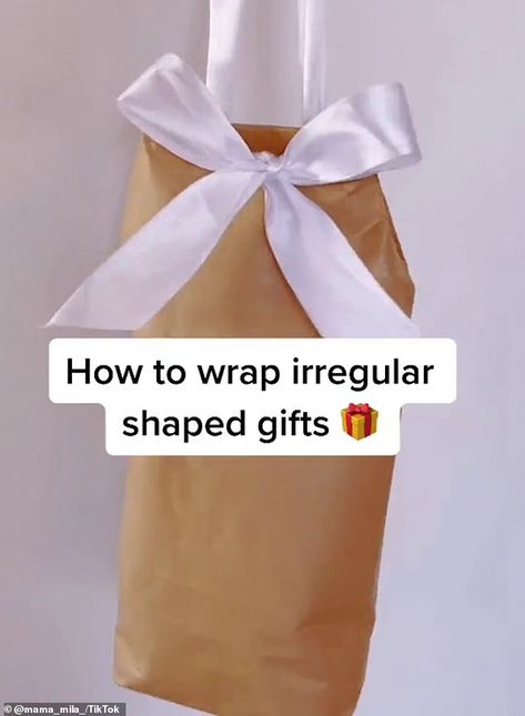 How to wrap your Christmas presents like a pro: Mama Mila mum's simple video wows millions  | Daily Mail Online Soft Gift Wrapping, Wrap Presents, Simple Video, Soft Gift, How To Wrap, Present Wrapping, Soft Toys, Christmas Gift Wrapping, Diy Projects To Try