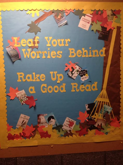 My try at the Fall into Good Reading bulletin board in the dorms. "Leaf Your Worries Behind. Rake up a Good Read" with book suggestions. A resident even suggested to encourage the hall to write their current semester worries on the leaves to "leaf" them behind! Fall Into Books Bulletin Board, Fall In Love With A Good Book Bulletin Board, November Reading Bulletin Boards, Fall School Display Case Ideas, Fall Display Case Ideas For School, Autumn Library Bulletin Boards, Fall Into A Good Book Display, Fall Book Fair Decorations, Fall Library Bulletin Boards Elementary