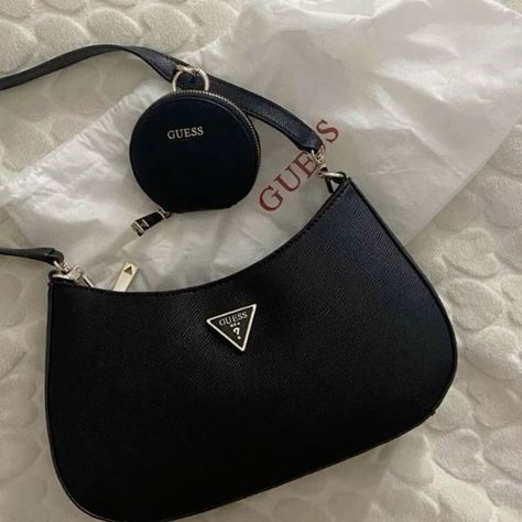 Elevate your accessory game with the GUESS Women's Noelle Top Zip Shoulder Bag! 💼 Perfect for everyday chic, this stylish bag adds a touch of glamour to any outfit✨ #GUESS #shoulderbag #womensfashion #handbag #stylishaccessories #fashionista #purseaddict #trendybags #luxuryfashion #shopaholic #baglover #accessoryoftheday #musthavebags #fashioninspiration #OOTD #purseobsession #bagstyle #handbaglover #fashionbloggers Guess Shoulder Bag Outfit, Shoulder Bag Outfit, Guess Shoulder Bag, Guess Handbags, Everyday Chic, Stylish Bag, Stylish Accessories, Cloth Bags, Fashion Bags