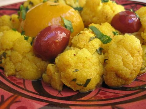 An easy Moroccan side dish with zesty Moroccan seasoning and preserved lemons . May also be served as a vegetarian main course. Moroccan Side Dishes, Moroccan Cauliflower, Vegetarian Tagine, Preserved Lemons Recipes, Moroccan Seasoning, Cauliflower Side Dish, Moroccan Recipes, Moroccan Cooking, Vegetarian Main Course