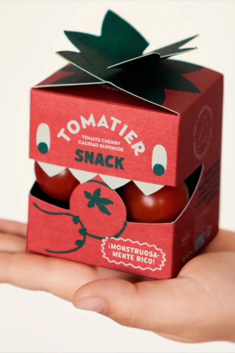 Meteorito hits a double whammy with their extremely cute design for Tomatier Snack’s cherry tomatoes: it looks like a little tomato with its smart red box and green, leafy tabs—and it looks like a little guy! Who doesn’t love a little guy? Pet Packaging Design, Packaging Box Design, Apple Picture, Monster Box, Visuell Identitet, Packaging Design Trends, Collateral Design, Cool Packaging, Branding Design Packaging