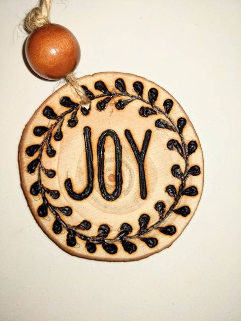 Hand burned wood ornament. Rustic Christmas Ornament wood burned on wooden circle chips. Custom chips upon request, select custom ornament then Convo me with the details of what you want. Wood Rounds Wreath, Woodburn Christmas Gifts, Burnt Wood Ornaments, Wooden Engraved Ornaments, Wood Burn Christmas Ornaments Diy, Flat Wood Ornament Ideas, Wood Burnt Ornaments Diy, Wood Burning Christmas Gifts, Wood Burning Ornament Ideas