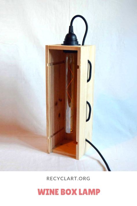 This lamp was made out of an upcycled old wine wood box. The lamp can be hanged by the wire as a pendant lamp or be transformed into a table lamp.    The black fabric electric wire snakes through the box.                   #Boxes, #Lamp, #Lights, #PendantLamp, #TableLamp, #UpcycledLighting, #Wine #LampsLights Diy Lamp Wood, Wine Box Table, Wine Box Diy, Wine Box Crafts, Refurbished Lamps, Diy Baby Room Decor, Upcycled Lighting, Wine Bottle Box, Wood Wine Box