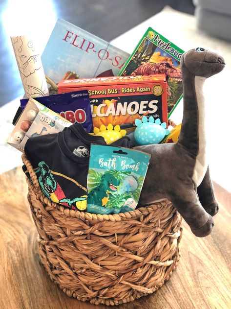 Dinosaur Themed Gift Basket, Dino Easter Basket Ideas, Dinosaur Gifts For Adults, Dinosaur Easter Basket Ideas, Dinosaur Gift Basket, Adult Gift Basket, Basket Themes, Dinosaur Easter Basket, Easter Basket Themes