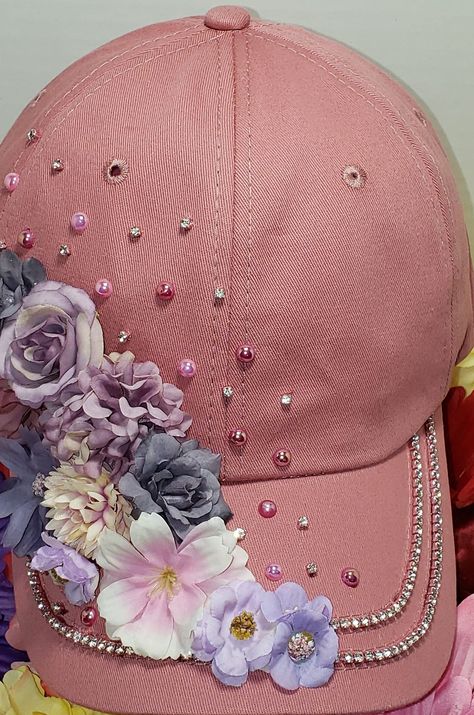 Dust pink hat with shades of pink 3D flowers accented with diamond rhinestone and pink  colored pearls. ONE SIZE FITS ALL Colors, hues and shades vary with each photo. Truckers Hats, Hat Embellishments, Craft Bouquet, Denim Hats, Altered Clothes, Hat Bar, Colored Pearls, Tea Hats, Dust Pink