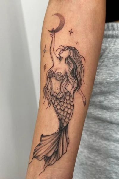 30+ Mermaid Tattoo Designs for Enchanting Ink - Tweakbee Mermaid Full Sleeve Tattoo, Cute Mermaid Tattoo, Black Mermaid Tattoo Designs, Treasure Tattoo Ideas, Water Women Tattoo, Mermaid And Sun Tattoo, Detailed Mermaid Tattoo, Hip Mermaid Tattoo, Mermaid Tattoo Ideas For Women Leg