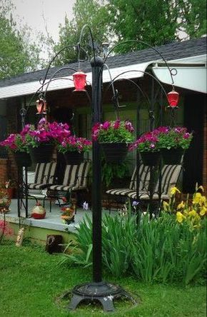 Hanging Planter made with an old tractor wheel, metal pole and old hay rake tines.... Antique Hanger, Metal Plant Hanger, Outdoor Plant Hanger, Metal Animals, Metal Plant Hangers, Umbrella Tree, Diy Macrame Plant Hanger, Diy Plant Hanger, Metal Pole