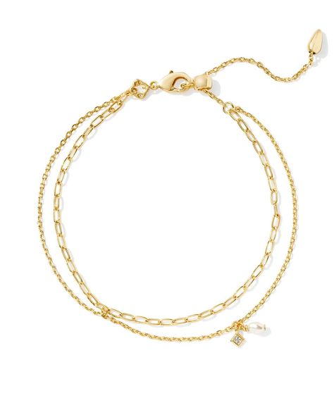 Stack up a style that’s dainty, chic, and full of shine with the Kendra Scott Eve Gold Multi Strand Bracelet in White Pearl. https://thetwistedchandelier.com/products/kendra-scott-eve-multi-strand-bracelet-gold-white-pearl Kendra Scott Gold Bracelet, Kendra Scott Charm Bracelet, Kendra Scott Bracelet Stack, Types Of Chains, Ugg Mini Boots, Kendra Scott Bracelet, Jewelry Kendra Scott, White Cowboy Boots, Mini Boots