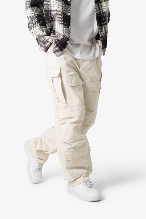 the Ultra Baggy Cargo Pants are designed with a new oversized ultra baggy fit, constructed from a ripstop fabric with a rinse wash, featuring cargo pockets throughout with snap closures, and finished with a button placket.  details ultra baggy fit throughout 100% cotton extended inseam model is 6’1, 140 lbs and wears a size 30 Mens White Cargo Pants Outfit, Kargo Styles Man, Nyc Winter Fashion Men, Light Brown Cargo Pants Outfit Men, Best Cargo Pants For Men, Mens Streetwear Pants, Gen Z Streetwear, Mens Clothing Styles Baggy, White Baggy Pants Outfit Men