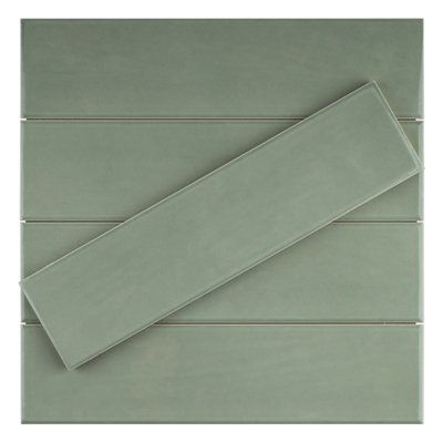 Zarati 3" X 12" polished ceramic subway wall tile is a perfect combination of classic and contemporary design. The tile is made of ceramic and has a polished finish that reinforces a high-end visual. The tile is ideal for kitchen backsplashes, showers, and bathrooms. The tile is 3" X 12" in size and can be installed in a variety of patterns. Color: Jade Green | Supreme Tile Zarati 2.95" x 11.81" Ceramic Wall Tile Ceramic in Green | 11.81 H x 2.95 W x 0.39 D in | Wayfair Green Kitchen Tiles Backsplash, Matte Tile Backsplash, Green Backsplash Kitchen, Sage Tile, Green Subway Tile, Green Backsplash, White Tile Backsplash, Brown County, Color Jade