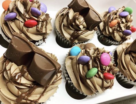 Chocolate cupcakes topped with Cadbury and smarties. #cadbury #chocolate #baking #cupcakes #cupcakeideas #birthday #food Cadbury Chocolate, Cupcake Designs, Birthday Food, Baking Cupcakes, Chocolate Baking, Chocolate Cupcakes, Cupcake, Baking, Birthday