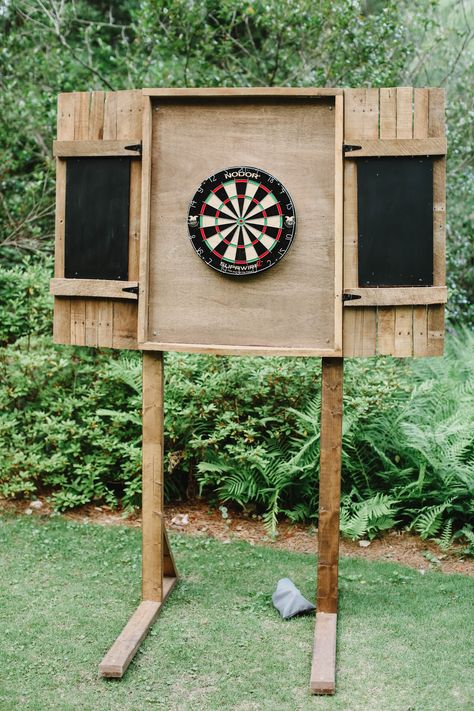 Dart Board Backboard Outdoor, Diy Wood Projects Outdoor Yard Games, Dart Board Wedding, Small Patio Wall Decor, Outdoor Dart Board Cabinet, Backyard Yard Game Area, Dart Board Outside, Horseshoe Pits Backyard, Large Backyard Lighting Ideas