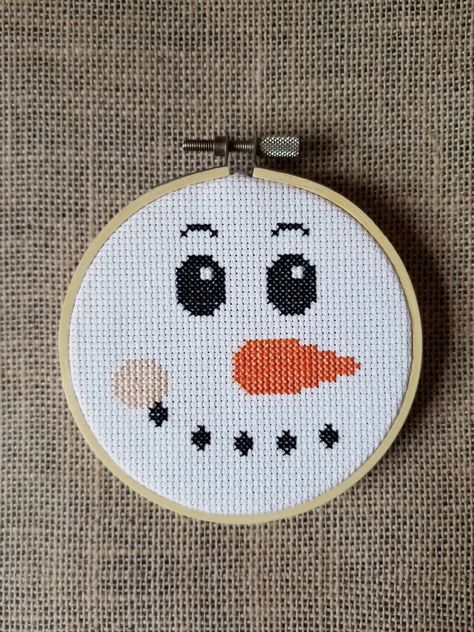 A snowman face counted cross stitch instant pdf download pattern. Design area measures 2.93" x 2.71" on 14 count aida.  Finished example piece pictured is in a 4" hoop. I'm happy to help so please feel free to contact me with any questions. Thank you! Snowman Cross Stitch Pattern Free, Easy Christmas Cross Stitch, Christmas Cross Stitch Patterns Free, Snowman Cross Stitch Pattern, Holiday Cross Stitch Patterns, Patterns Flowers, Holiday Cross Stitch, Xmas Cross Stitch, Face Pattern