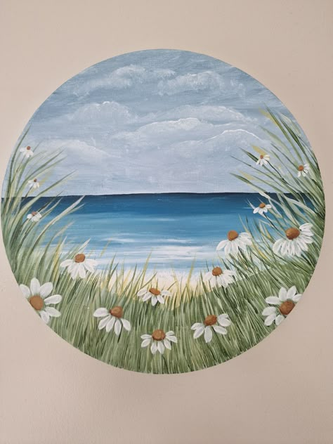 An acrylic seascape painting with daisys on a circle canvas Acrylic Circle Painting, Drawing On Round Canvas, Paintings On Circle Canvas, Painting Ideas Circle, Painting Ideas Circle Canvas, Painting Ideas On Circle Canvas, Round Painting Ideas, Circle Canvas Painting Ideas, Art In Circle