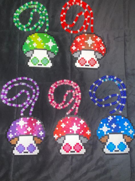 *Trippy Mushroom Perler Necklace *Choose your colour *Necklace or no necklace option available *Bead colours may vary slightly from pictures but will always be cute!!  *Every order comes with a hand written note Enjoy USA BUYERS: Please note that the small packet shipping option comes with NO TRACKING. New Perler Bead Patterns, Pearler Necklace Ideas, Rave Perler Necklaces, Perler Necklace Ideas, Perler Bead Necklace Ideas, Perler Ideas Rave, Rave Fuse Beads, Perler Bead Crystal, Liquid Stranger Perler