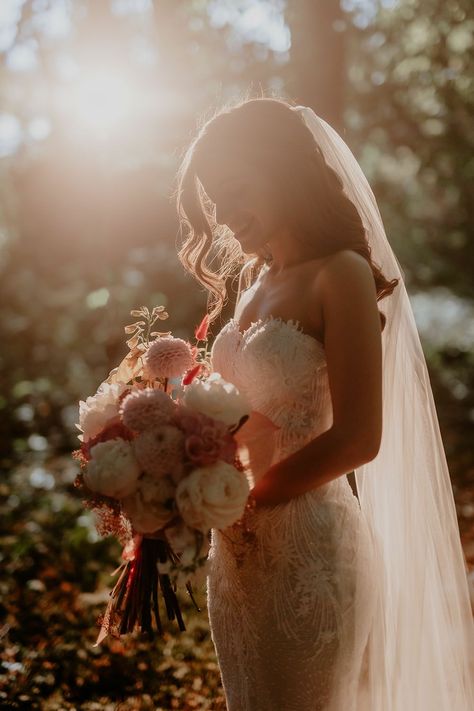 Bride holds pink and white floral bouquet tied with pale pink ribbon during golden hour portraits outdoors Boho Wedding Photography Poses, Sunset Bridal Portraits, Bouquet Wedding Photos, Creative Bridal Photoshoot, Sunset Pictures Wedding, Bride With Bouquets Around Face, Bridal Photoshoot Ideas Outdoors, Wedding Bride Pictures, Timeless Romantic Wedding Photos