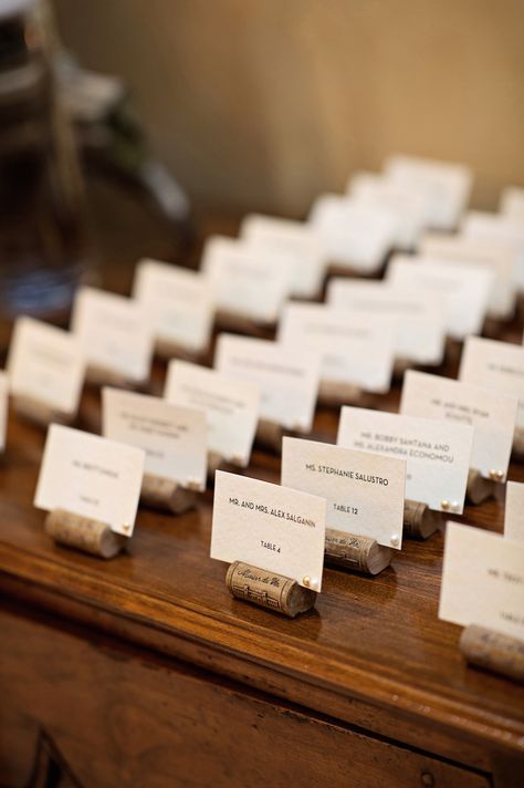 Even the most caring, invested wedding guest looks forward to the reception… Wine Cork Centerpiece, Wine Cork Place Card Holders, Cork Place Card Holders, Cork Place Cards, Wine Cork Table, Greek Wedding Candles, Wine Cork Place Card Holder, Wine Cork Wedding, Cork Wedding