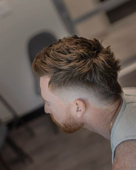 A Mohawk cut with hair extending from front to nape and barely noticeable fading on the sides Cyberpunk Hairstyles, Mid Fade Haircut, Short Hair With Beard, Mullet Fade, Curly Afro Hair, Mohawk Hairstyles Men, Gents Hair Style, Mullet Haircut, Faded Hair