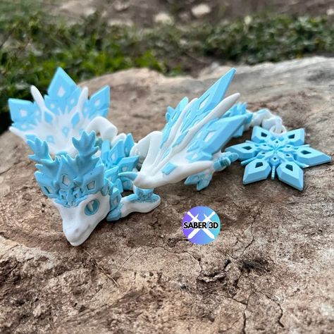 Articulated Baby Snowflake Dragon by Saber3D by Saber3D - MakerWorld Articulated Dragon 3d Print, 3d Printed Dragon, Dragon 3d, Baby Dragons, Bluey And Bingo, New Dragon, Baby Dragon, Cozy Christmas, Christmas Prints