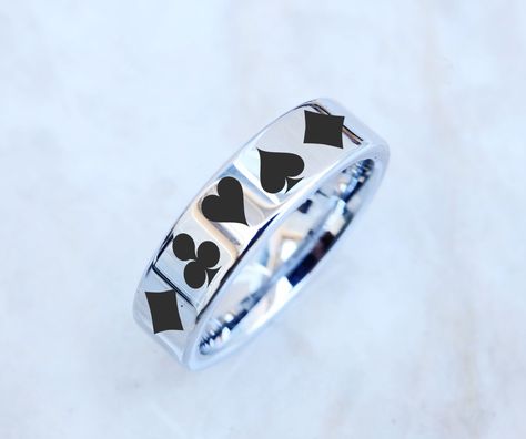 "**Please note any of our engraving designs can be engraved on any ring style within our shop! Send us a message to get started☺️ This is a beautiful one of a kind custom engraved poker ring on our flat ring style! The engraving wraps around the entire ring evenly. This listing is 6mm by default but you can request different at checkout :) ABOUT OUR ENGRAVINGS Our engravings are 100% permanent and are produced with a state of the art laser engraving machine. The color of our engravings are 100% Ace Ring, Solitaire Wedding Band, Tangled Jewelry, Star Wedding Band, Engraving Designs, Band Playing, Flat Ring, Star Wars Wedding, Wolf Jewelry