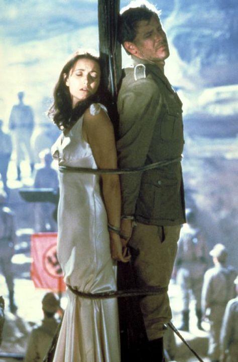 I'm an incredible Indiana Jones nerd, however Marion's satiny shoulder-tied gown from Raiders is so simple and lovely. Henry Jones Jr, Harrison Ford Indiana Jones, Karen Allen, Indiana Jones Films, Raiders Of The Lost Ark, Henry Jones, Lost Ark, Harrison Ford, Steven Spielberg