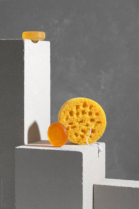 Natural plant based solid honey color soap bars and scrubbing sponge over gray background with podium Sponge Photography, Soap Photography, Fashion Reference, Gray Fashion, Food Drink Photography, Honey Soap, Beauty Products Photography, Styling Inspiration, Soap Bars