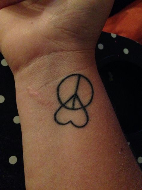 My peace and love tattoo :) I love it to bits I got it when I was in Hawaii . It symbolizes that I am at peace with everything in my life and I have finally learnt to love myself :D Tattoo For Peace Symbols, Symbol For Peace Tattoo, Peace Love Empathy Tattoo, Love And Peace Tattoo Ideas, Peace And Love Tattoo, Love Peace And Happiness Tattoos, Peace Love Harmony Tattoo, Peace Sign Tattoos, Rip Tattoo