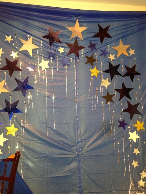 To Make a Photo Booth...Get a table cloth...I use several! Attach to Wall...now add some stars (or props for whatever theme your doing)...and your done! You can buy a photo prop kit at Walmart or Party City (you can even make your own by buying some props from Michael's craft store and painting them. It's just that easy! Check out my Photo Booth Signs & IG signs! @Kelly Norelius-Bresnahan Star Themed Photo Booth, Under The Stars Photo Booth, Cheap Photo Booth Ideas, Photo Booth Signs, Homecoming Decorations, Star Birthday Party, Janmashtami Decoration, Photo Booth Sign, Sweet 16 Decorations