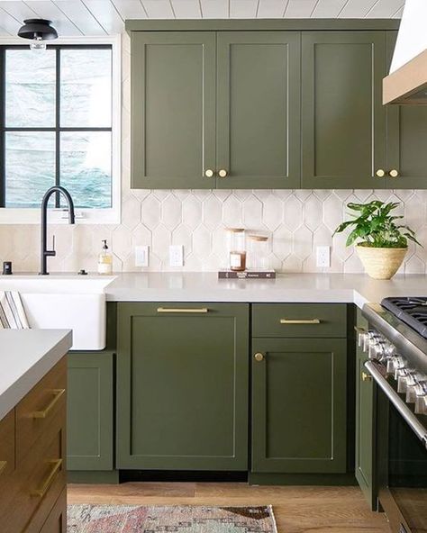 a catchy green kitchen with a white tile backsplash and gold touches plus black fixtures is super stylish Kitchen Millwork, Kitchen With Green Cabinets, Olive Green Kitchen, House Upgrades, Bold Kitchen, White Tile Backsplash, Blue Kitchen Cabinets, Green Kitchen Cabinets, Green Cabinets