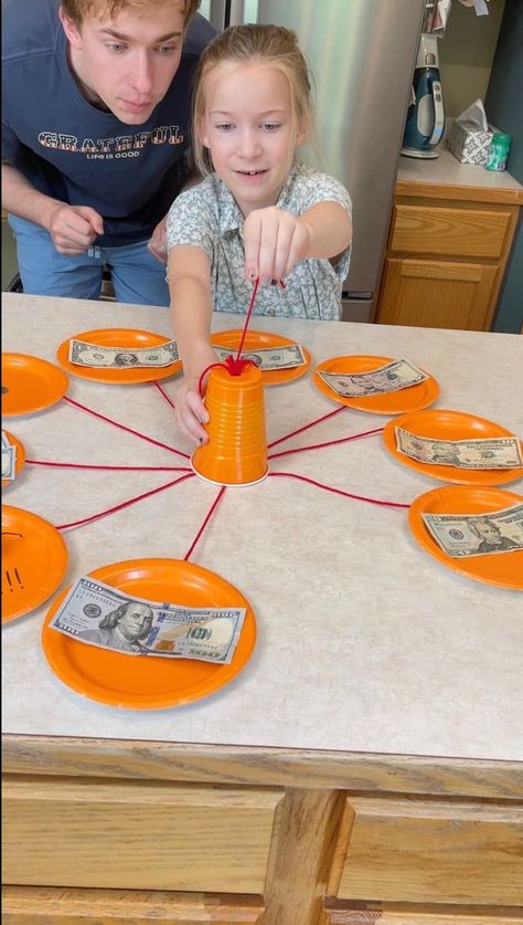 Hot Pepper Roulette 🔥 | prize, Roulette | Hot Pepper Roulette 🔥 Dad and kids play family table game where they pull strings for cash prizes. Hot pepper punishment at the end. This video was... | By Fast, Funny & Funfas | Facebook | Okay, pull a string. Pull a string. $50. $50. Your turn, Kezzy. Pull a string. Here. Do it. Do it. Pull a string. You got it. $100. $100. Let's go. Pull a can. Here we go. Come on. Come on. Come on. And guys, right here is the bad punishment. Oh. It's a hot habanero Gift Card Roulette Game, Christmas Roulette Game, Christmas Present Roulette, Family Prizes For Games, Pick A Prize Game, Game Night Prizes Ideas, Games To Play For Prizes, Cute Prizes For Games, Egg Roulette Games