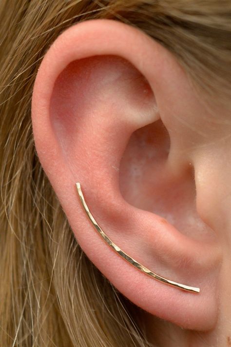 "This ultra simple and sleek Hand Hammered Ear Pin comes in two sizes to custom fit your ear beautifully. It fits gracefully up the natural curve of your ear with shimmer and pizzazz! This earring only requires one standard ear piercing. It is shaped like a bobby pin, and the wire on the back of the ear holds the ear pin in place, comfortably and securely. We use 18...#Style #Gemstone #StatementJewelry #JewelryAddict #JewelryDesign #Accessories #Fashion #HandmadeJewelry #Jewelry #JewelryLovers Jóias Body Chains, Gold Ear Climbers, Faux Piercing, Ear Pin, Ear Crawler, Ear Climbers Earrings, Ear Climber, Ear Pins, Climber Earrings