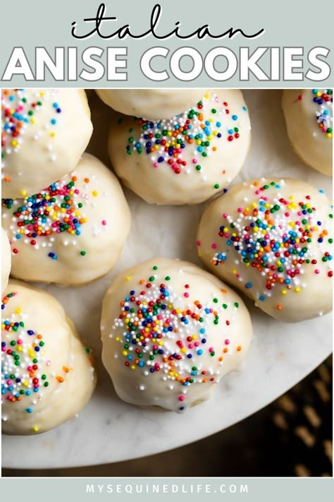 Glazed anise cookies with nonpareils on a tray. Italian Knot Cookies Recipes, Anginetti Cookies Italian, American Party Food, Anginetti Cookies, Italian Knot Cookies, Popular Christmas Cookies, Italian Holiday Recipes, Anisette Cookies, Italian Anise Cookies