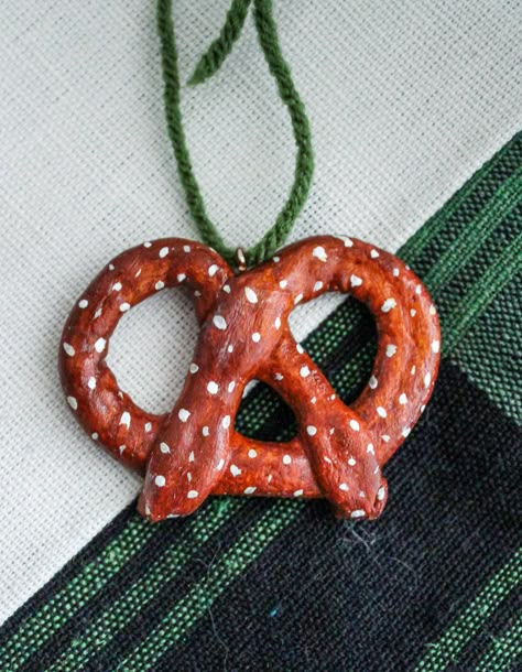 "Give your Christmas Tree a POP with this Handmade Pretzel Christmas Ornament!  This listing if for ONE Pretzel Clay Ornament. It measure approx 4\" with a screw eye  and twine on top for easy hanging.  * Size and colors may vary slightly. These ornaments are handmade and one of a kind- please handle gently and carefully* Shipping times are Approximate! Thanks!" Pretzel Christmas, Salt Dough Christmas Ornaments, Handmade Felt Ornament, Decor Gift Ideas, Christmas Holiday Decor, Christmas Clay, Clay Ornaments, Ceramics Ideas Pottery, Diy Clay Crafts