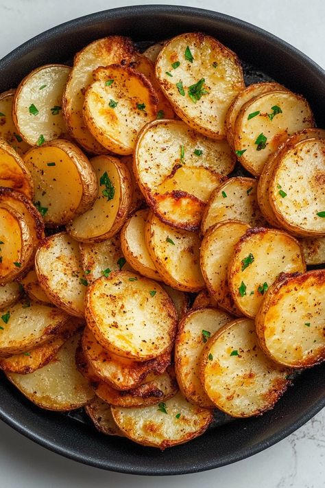 Crispy Air Fryer Sliced Potatoes – The ultimate side dish made in minutes! These perfectly seasoned, golden-brown potato slices are crispy on the outside, tender on the inside, and cooked to perfection in the air fryer. A quick, healthy, and easy recipe for family dinners, snacks, or meal prep. Elevate your potato game with this must-try dish! Air Fry Potato Skins, Air Fryer Potato Crisps, Raw Potatoes In Air Fryer, Potato Rounds In Air Fryer, Loaded Air Fryer Potatoes, Fry Potatoes In Air Fryer, Cast Iron Potatoes Recipes, Idaho Potato Recipes Air Fryer, Whole Potatoes In Air Fryer