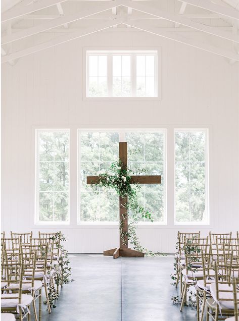 Leigh Elizabeth Photography Wooden Cross Wedding, Cross Wedding Ceremony, Arch With Greenery, Ceremony Cross, Modern Farmhouse Wedding, Church Aisle Decorations, Farmhouse Wedding Venue, Christian Wedding Ceremony, White Modern Farmhouse