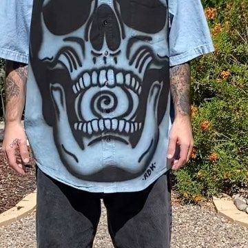 RBK Art Studios on Instagram: "This piece was my first time airbrushing on a button up shirt. It was a little bit of a challenge to go over the buttons but I’m really happy with how this one came out and I’ll definitely be making some more in the future. This piece is 1 of 1 and is already sold. More pieces are on my website #airbrush #airbrushart #airbrushtshirt #artist #handmade #craftsman #streetwear #clothingbrand" Airbrush Art Shirt, Airbrush Streetwear, Painted Button Up Shirt, Airbrushed Shirts, Airbrush Fashion, Spray Paint Shirt, Airbrush Clothes, Clothing Customization, Airbrush Shirts