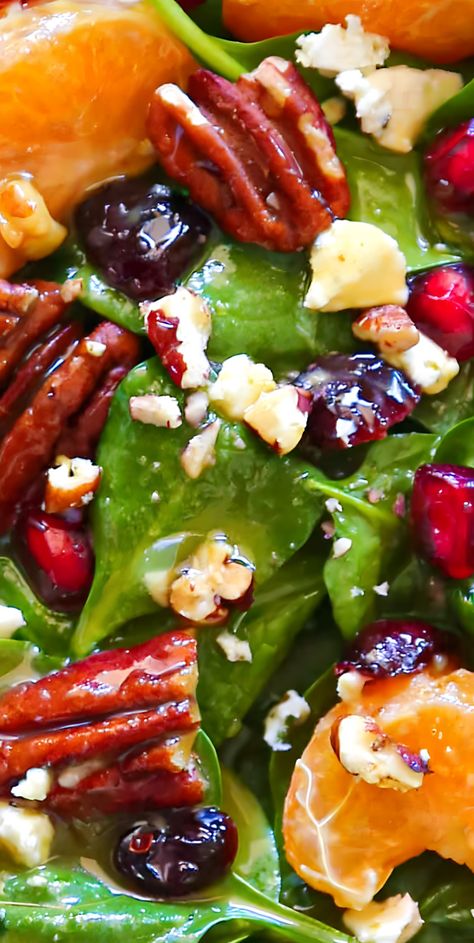 This simple 20-Minute Christmas Salad features classic holiday ingredients, such as pecans, mandarin oranges, pomegranate seeds, and dried cranberries. They are tossed with baby spinach, goat cheese, and homemade Honey-Mustard Lime Vinaigrette. This festive holiday salad will pair beautifully with your favorite Christmas main course and will be a great addition to your holiday menu. Honey Mustard Lime Vinaigrette, Salad Wreath Christmas, Xmas Pasta Salad, Christmas Spinach Salad, Holiday Honey Crisp Salad, Christmas Salads Australia, Holiday Green Salad Recipes, Salad With Strawberries And Pecans, Christmas Tossed Salad